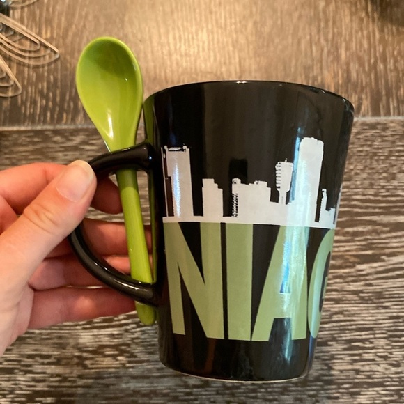 Other - Niagara Falls-Black and Green Coffee Mug, with a convent spoon in the handle.